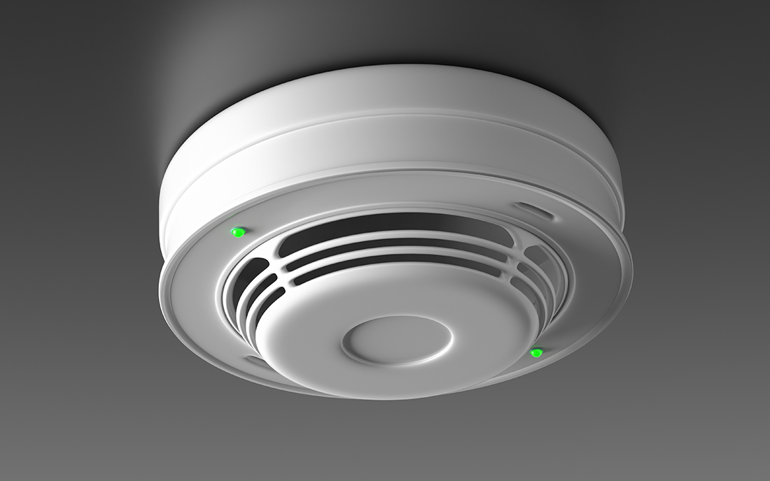 Feuermelder an grauer Decke